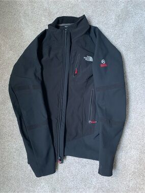 The North Face Black Softshell Performance Jacket with Red Accents